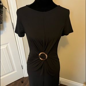 2/$20 item. NWT. Flattering, Black mid length dress gathered at waist. Sz. Sm